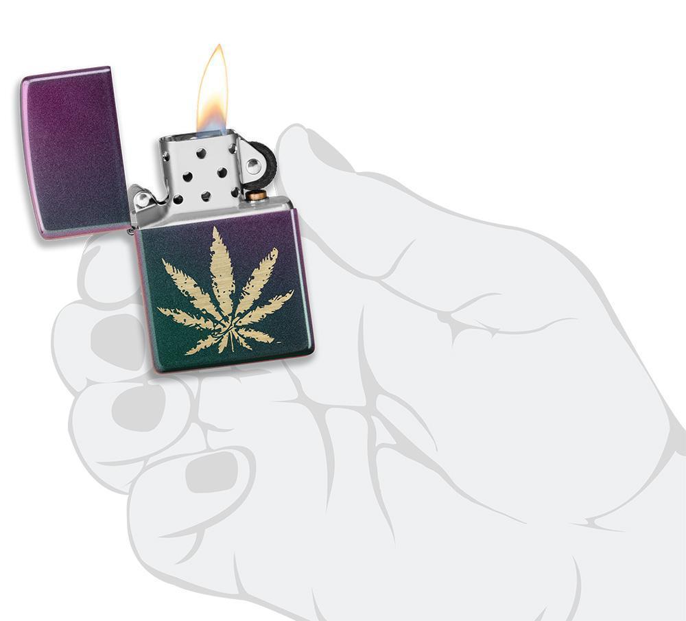 Iridescent Marijuana Leaf Windproof Lighter lit in hand