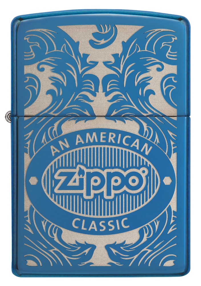 Blue Zippo lighter, front view, surrounded by a laser-engraved filigree motif showing the Zippo logo and "an american classic".